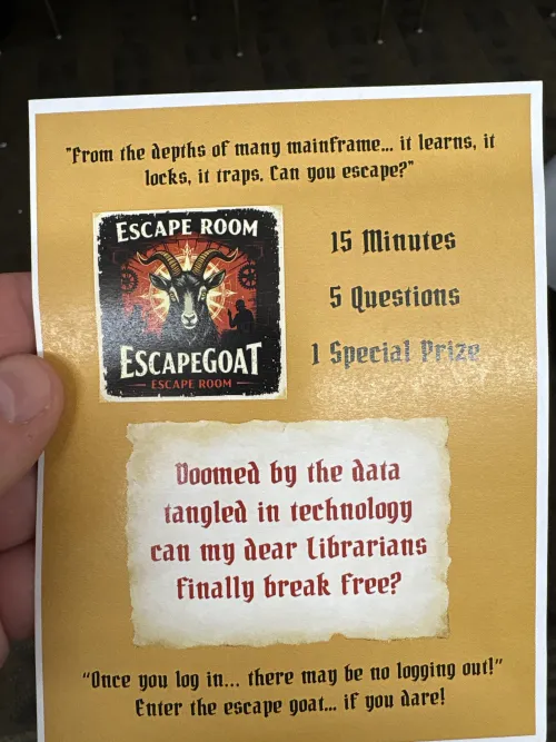 Flyer handed out at the conference featuring a goat icon & "Doomed by the data tangled in technology can my dear librarians finally break free?" At the bottom, a quote reads: "Once you log in... there may be no logging out! Enter the escape goat... if you dare!"